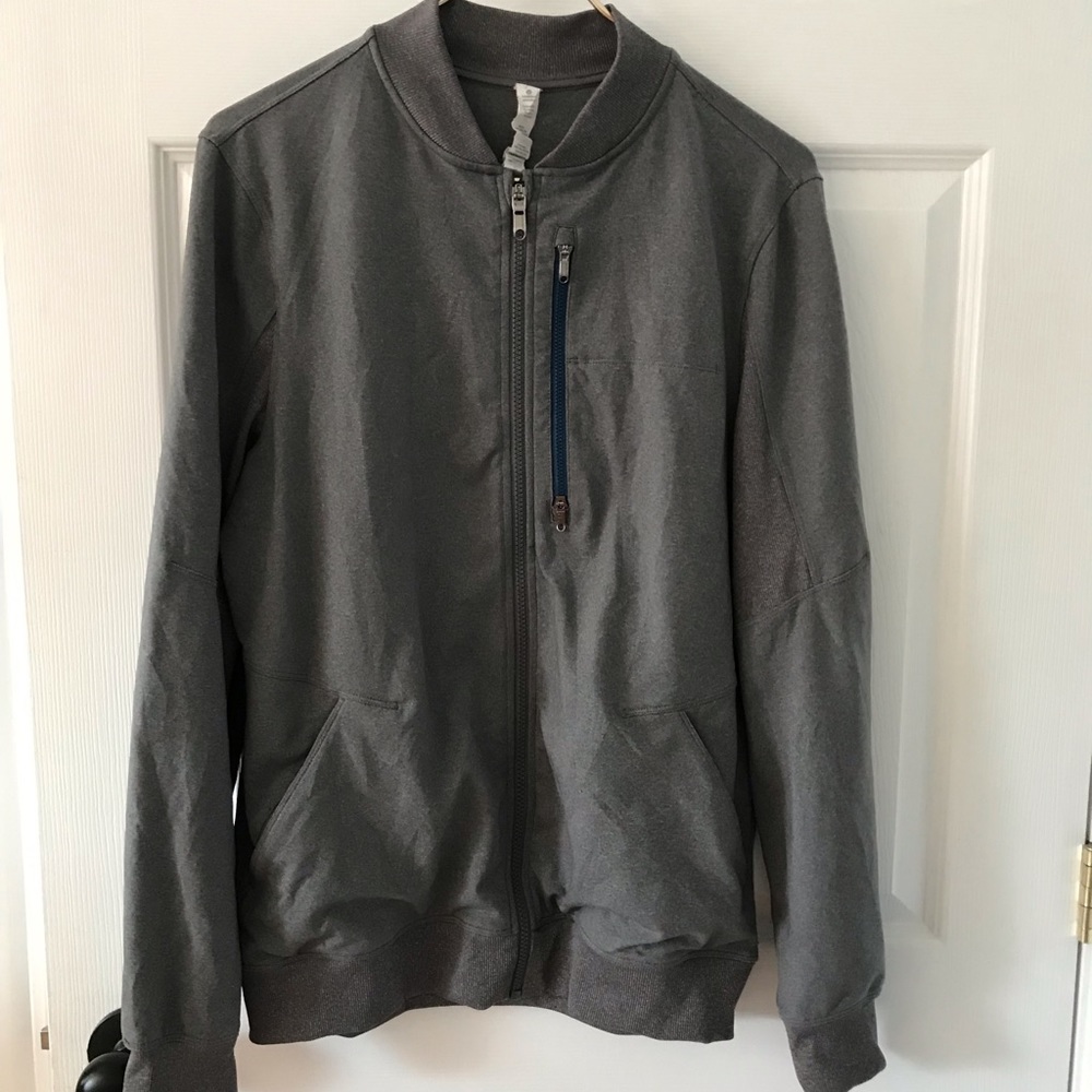 Lululemon running jacket has blue zipper on front pocket